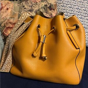 Zara goldenrod drawstring bag with fabric strap. Vegan leather. Good condition.